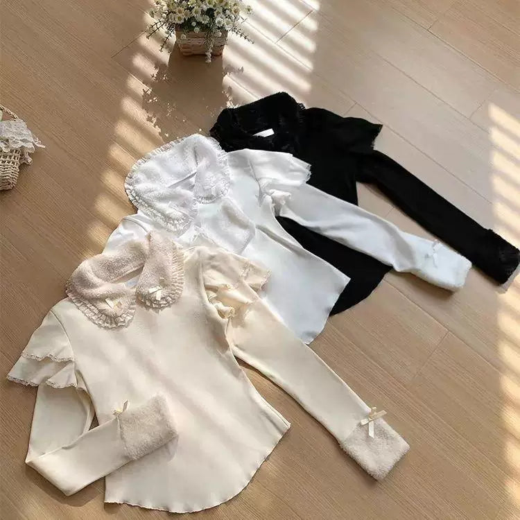 Light pink and black long-sleeve knit underlayers with ruffled collars and cuffs.
