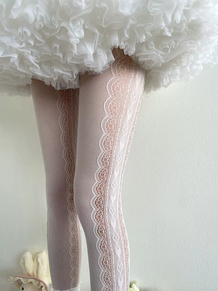 White lace-panel faux over-the-knee pantyhose shown beneath a ruffled skirt.