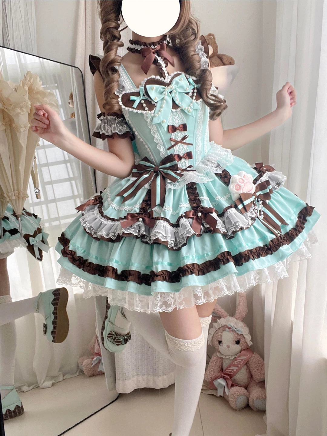 Mint JSK dress set with chocolate-brown bows, white lace ruffles and a full layered skirt shown on a model.