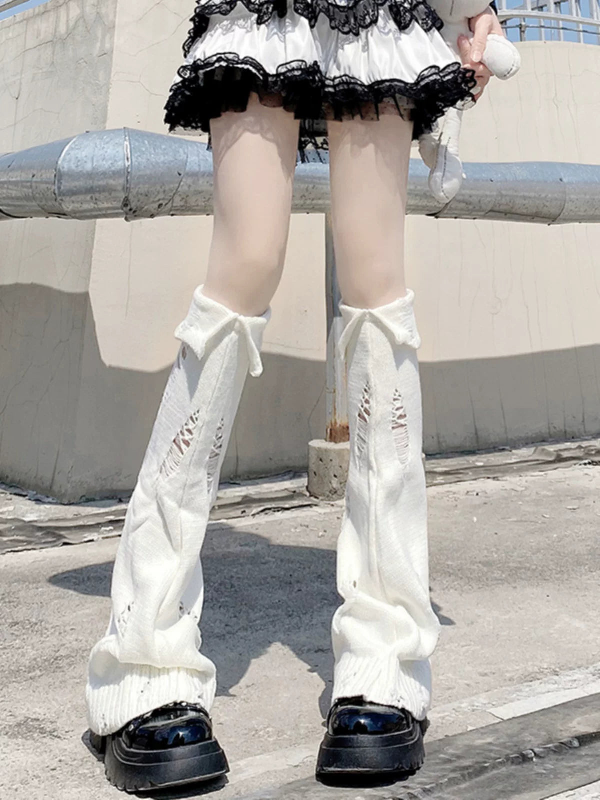 Milky-white ripped-hole knit leg warmers with fold-over cuffs