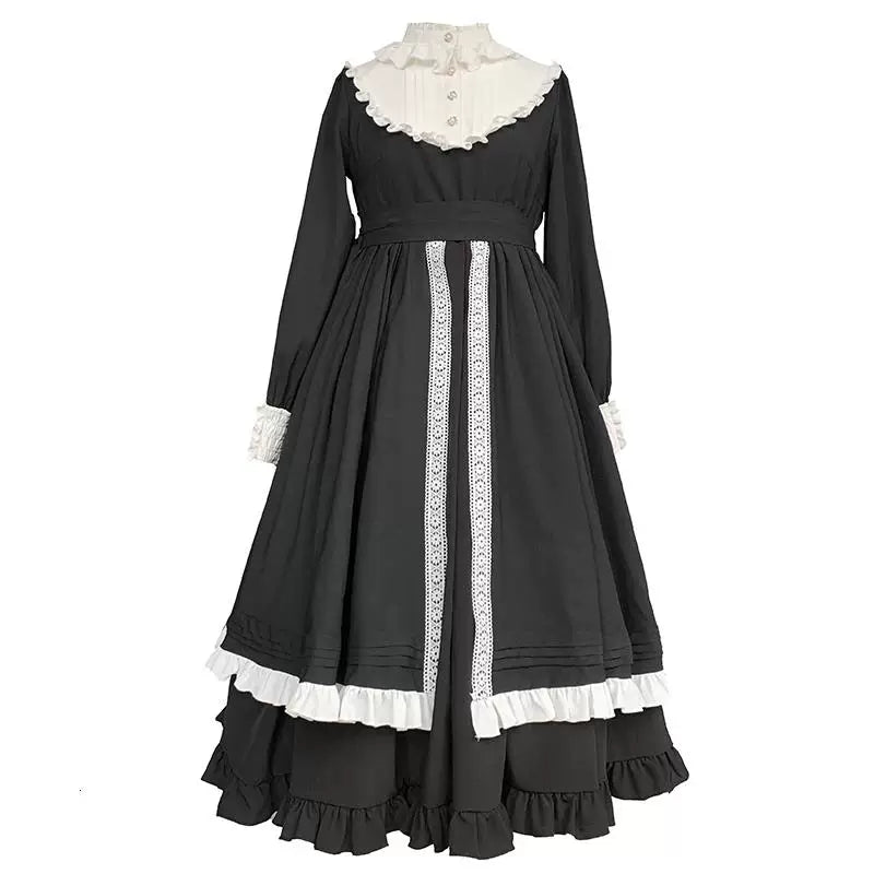 Black one-piece dress with white lace trim and a full skirt.