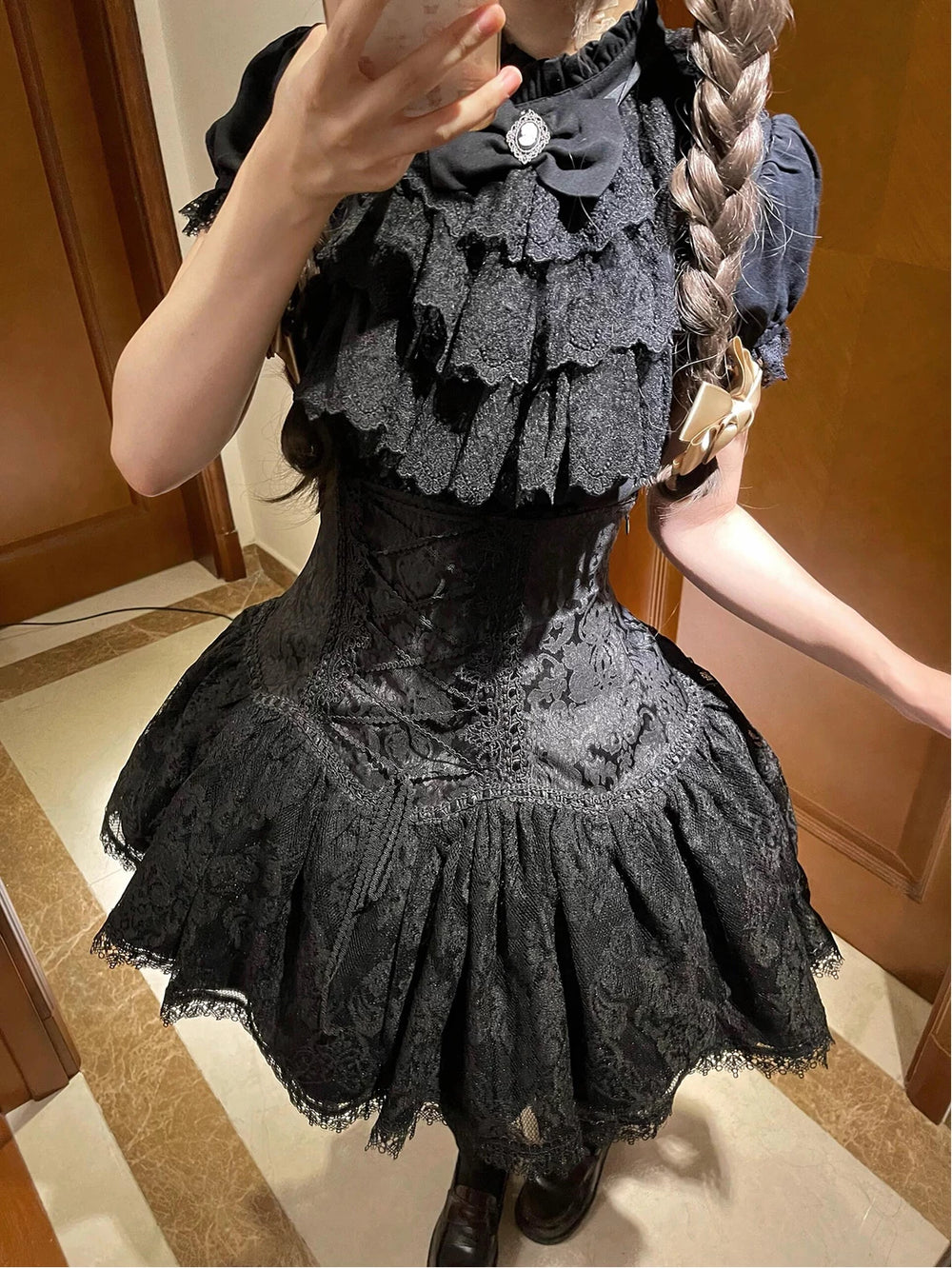 Black blouse set with layered lace bib and matching ruffled skirt