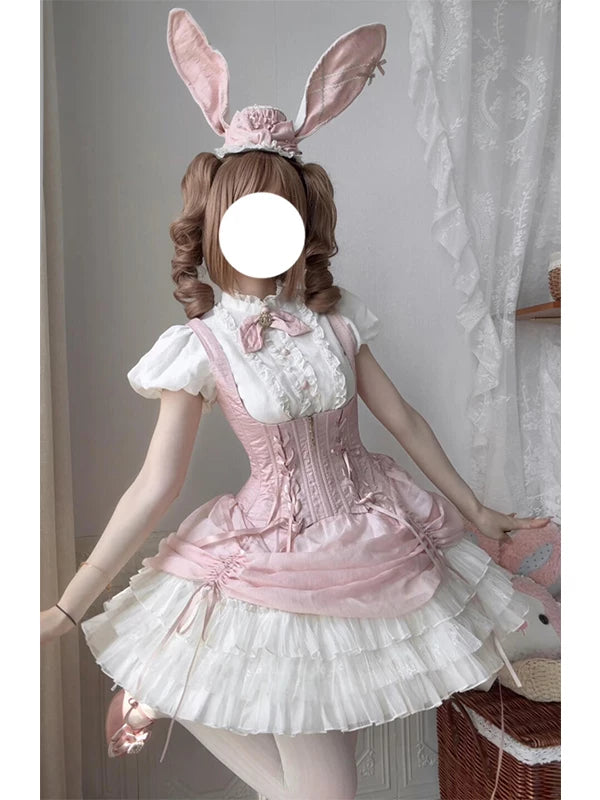Pink rabbit-themed JSK set with white frills, bow tie, and rabbit-ear hat, worn by a model.