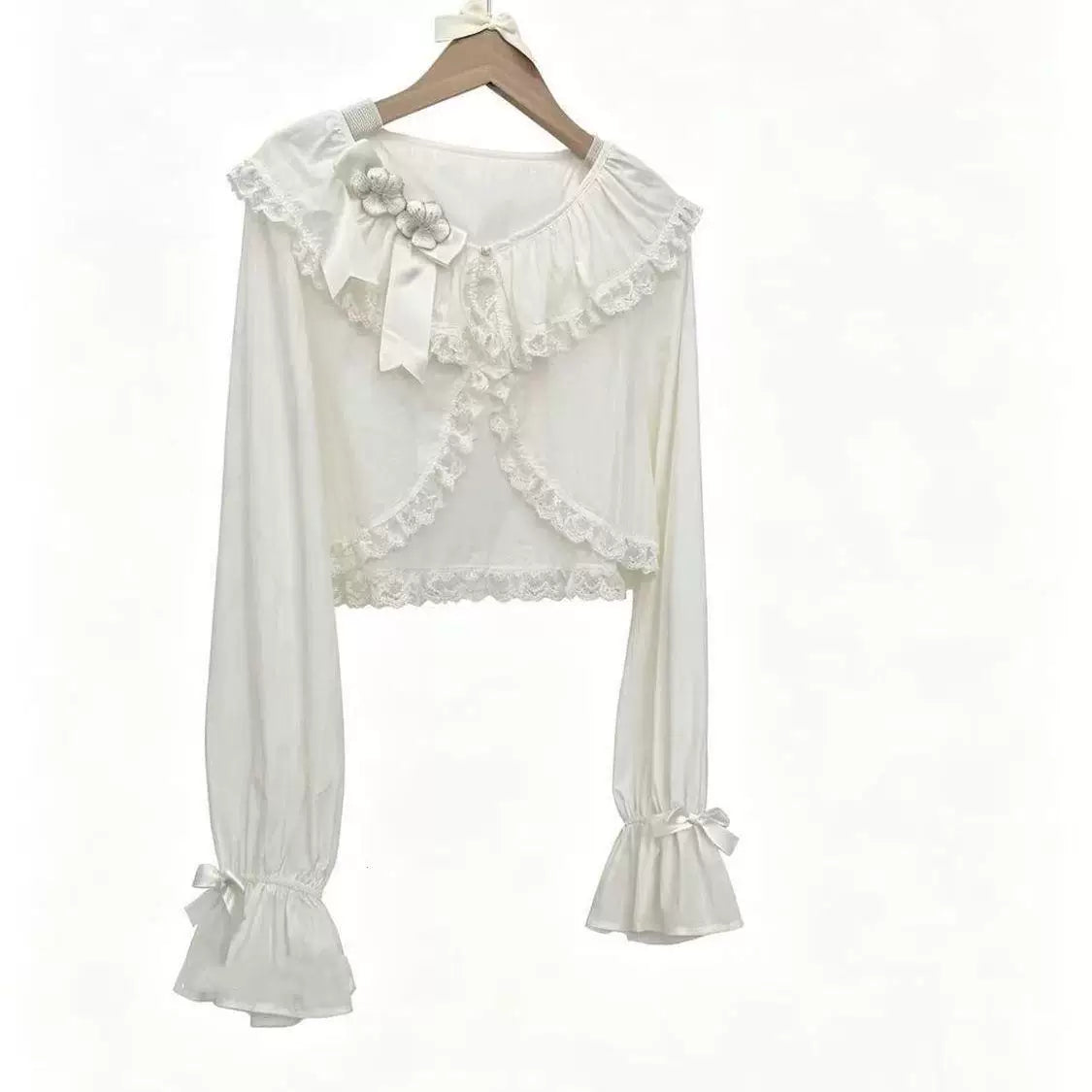 Purple Sweet Lolita cropped lace cardigan with bow accents, long sleeves, and ruffled collar
