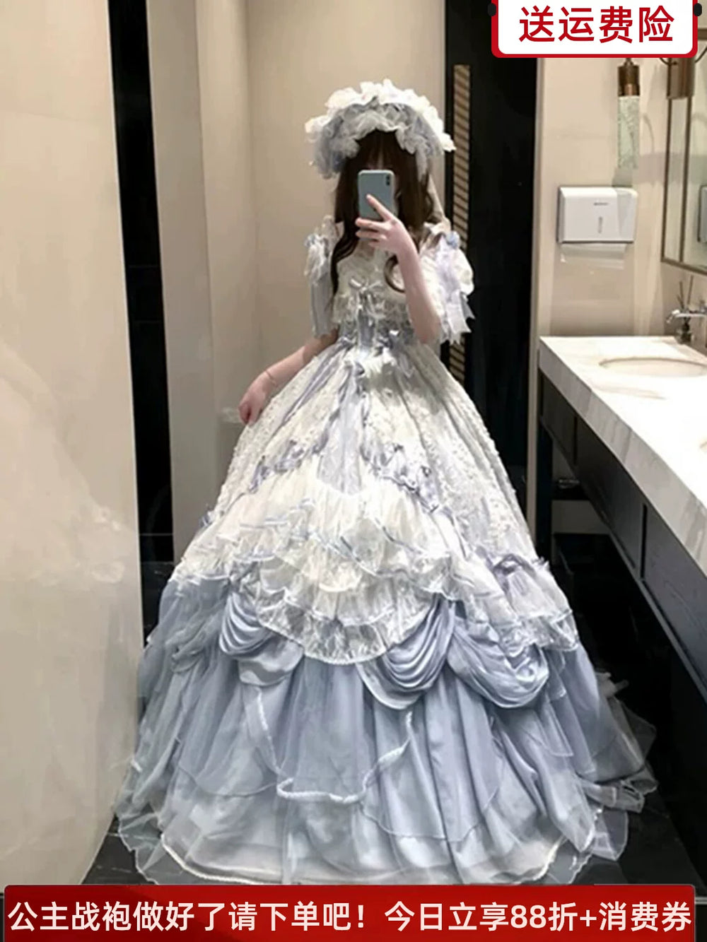 Light blue Lolita formal dress with off-the-shoulder neckline and tiered skirt on a mannequin