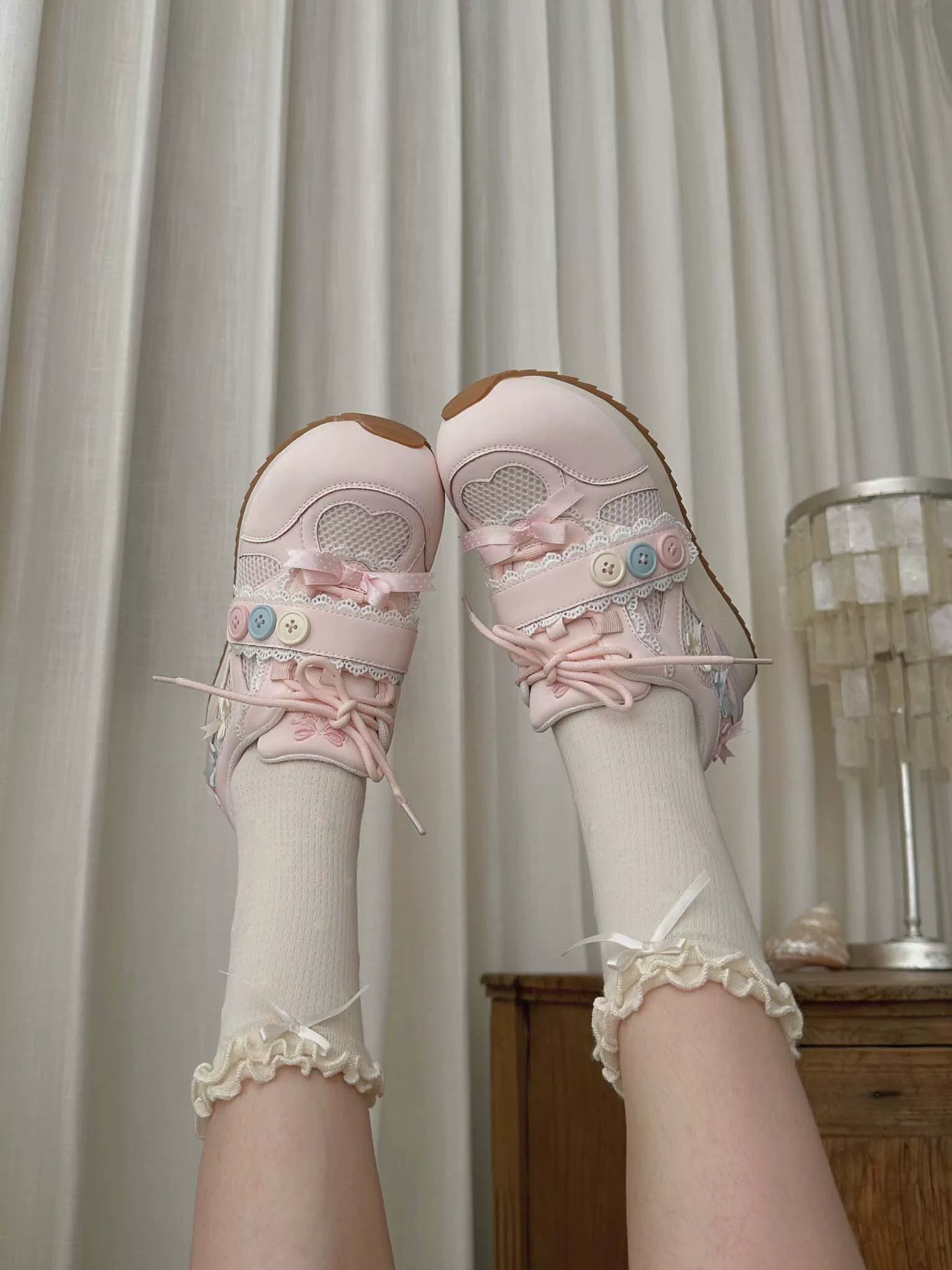 Sheep Puff Little Button Lo-Run Lolita Sneakers featuring cute sheep puff design and button accents on white shoes.