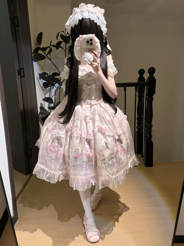 Pink printed OP dress with layered ruffles, bows and a free headband shown in a mirror.