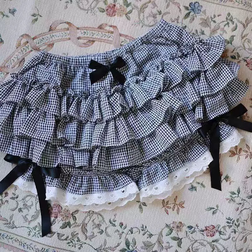 Black-and-white plaid tiered skort with layered ruffles and lace hem