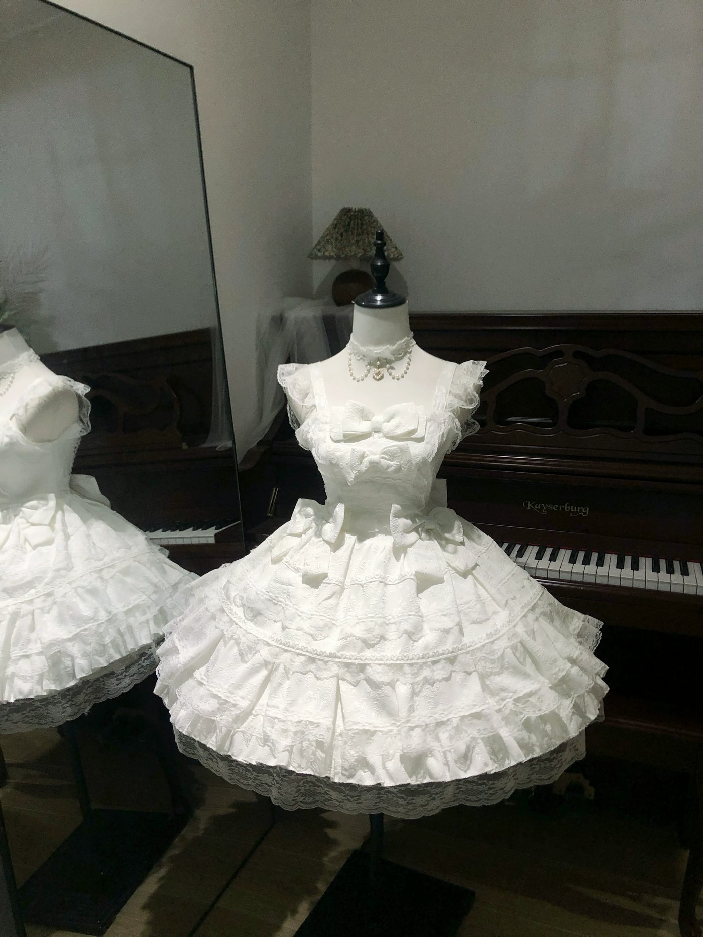 White Sweet Lolita JSK displayed on mannequin showing full tiered skirt and lace details