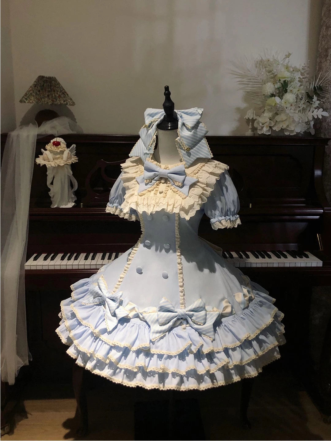 Creamy blue-and-cream striped ruffle dress displayed on a mannequin