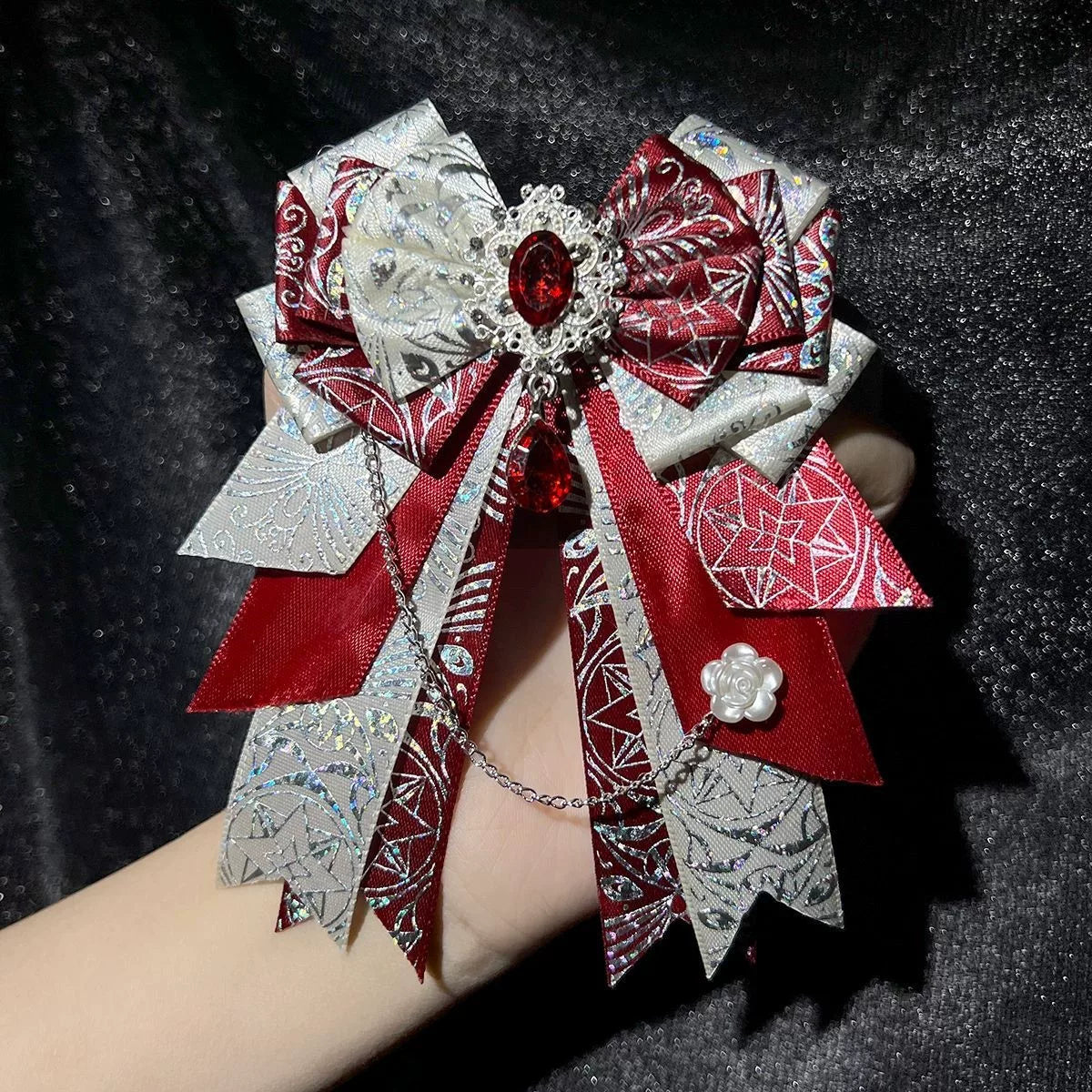 xxc230589 - Snowflake Diamond Bow - Layered bow brooch with a dangling chain