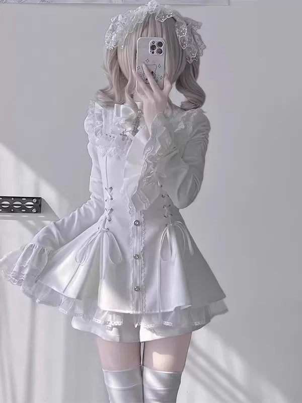 White lace OP set with bell sleeves, buttons and a shaped waist in a mirror photograph
