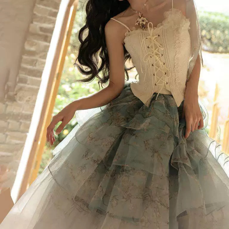 Cream corset-style top and pale blue tiered underskirt with swan and floral artwork