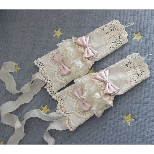 Pale lace Lolita arm sleeves with ribbon bows and pearl-like accents