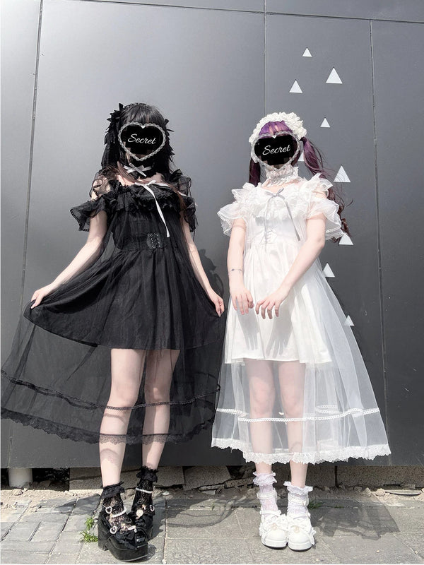 Black and white strappy dresses with sheer overlay veils and lace trim