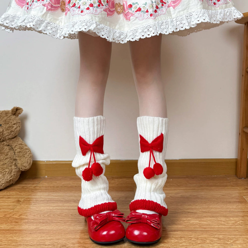 White and red scrunch socks with oversized bows and dangling pom-poms