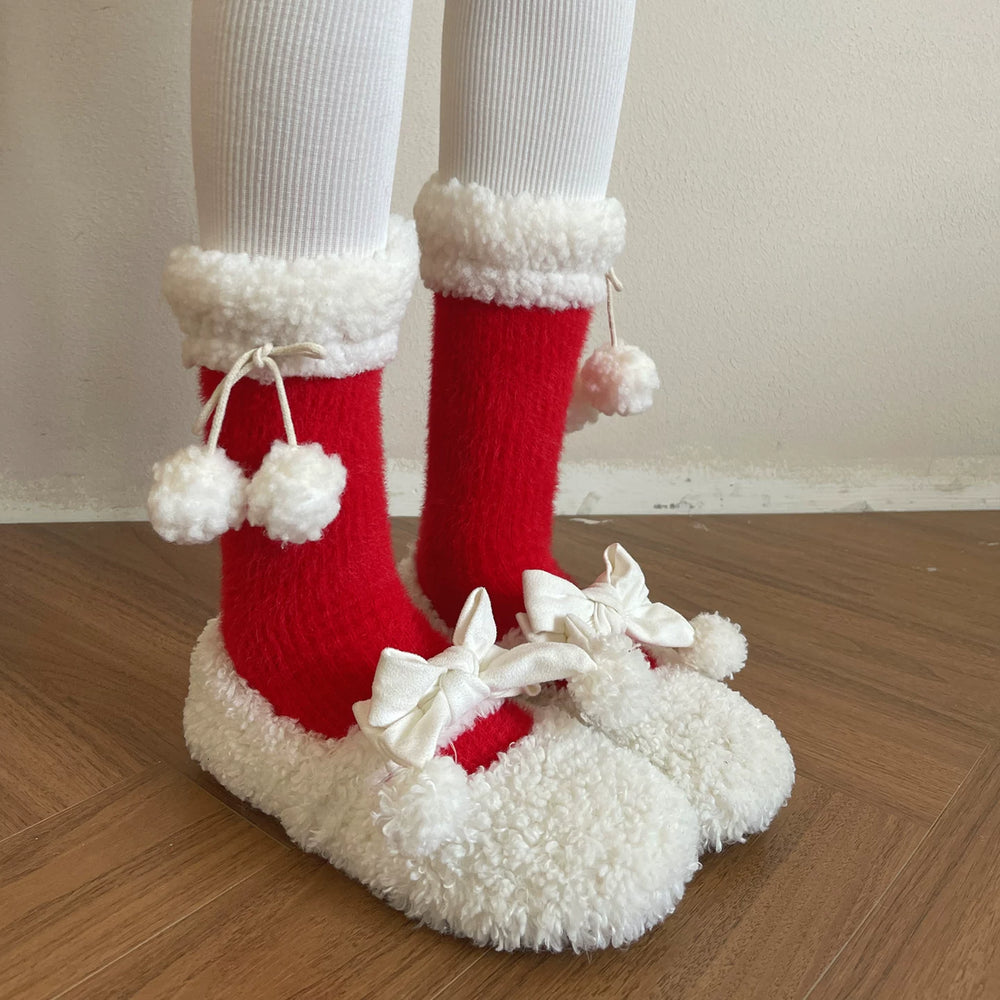 Plush slouch socks with fuzzy cuffs, tie cords and pom-pom accents.