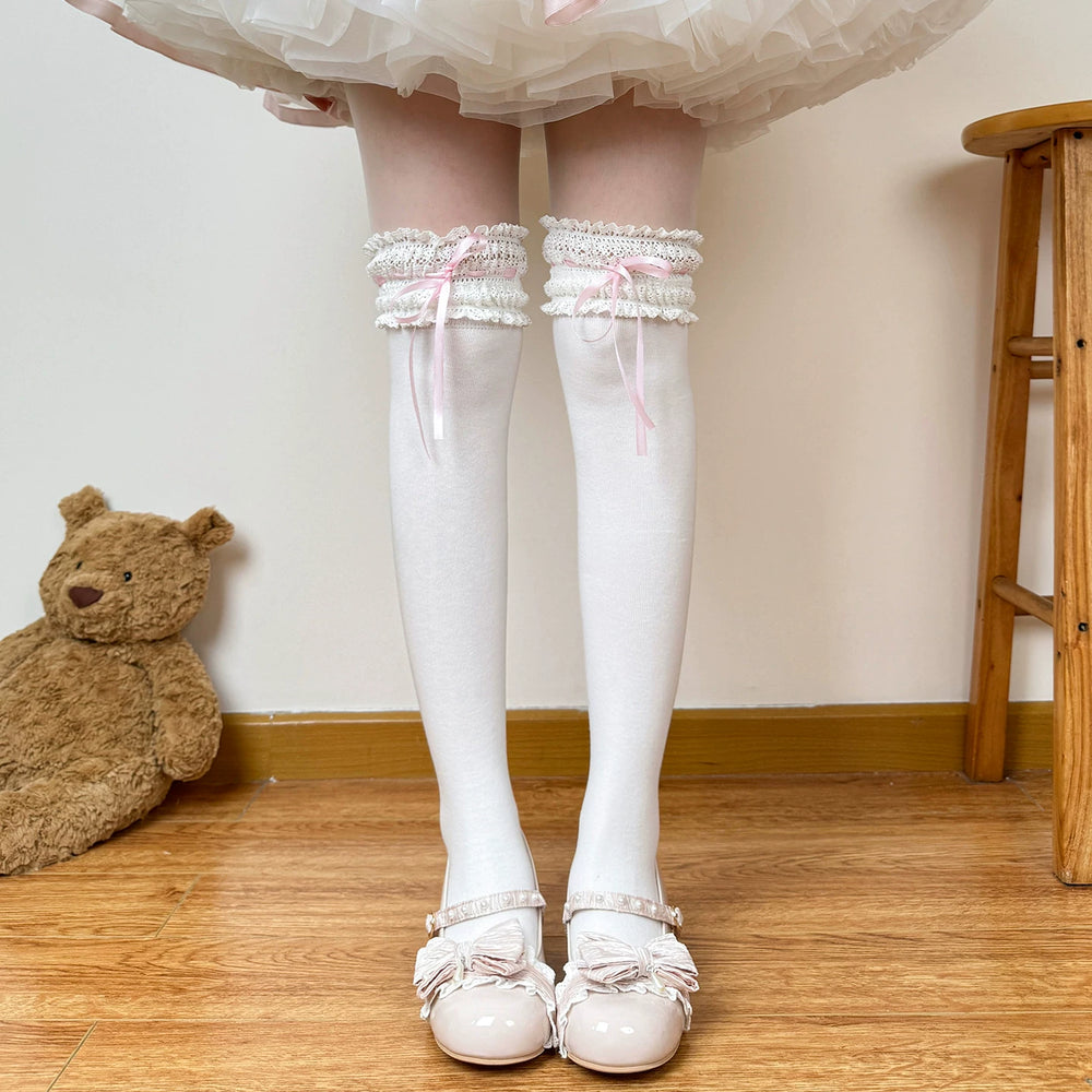 White over-the-knee socks with pink ribbon and lace trim