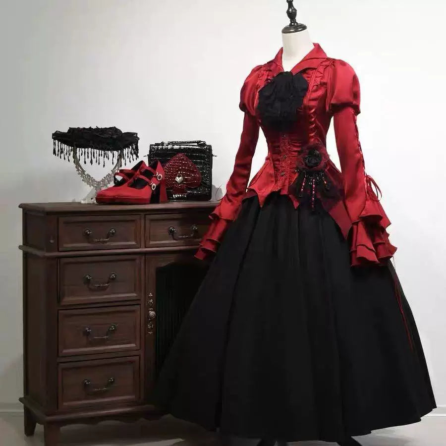 Dark Lolita blouse with asymmetric pointed front and batwing-style sleeves