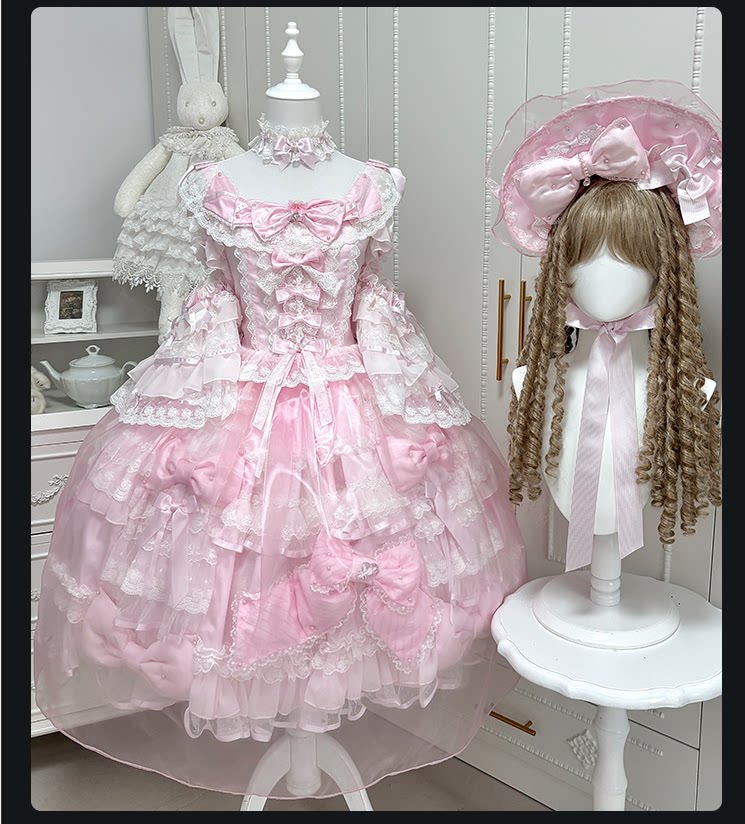 Pink princess-style Lolita JSK with layered lace, bows and ruffles