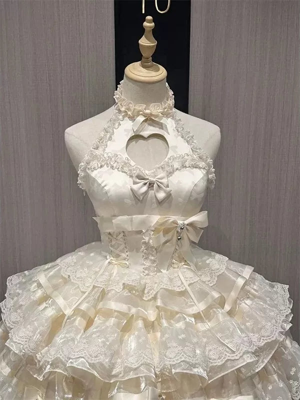 Ecru satin Lolita dress on a mannequin with a heart cutout, lace tiers and bows.