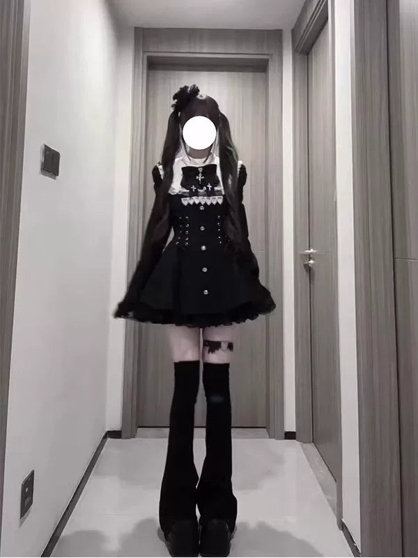 Model wearing a black-and-white long-sleeved Lolita dress in a hallway.