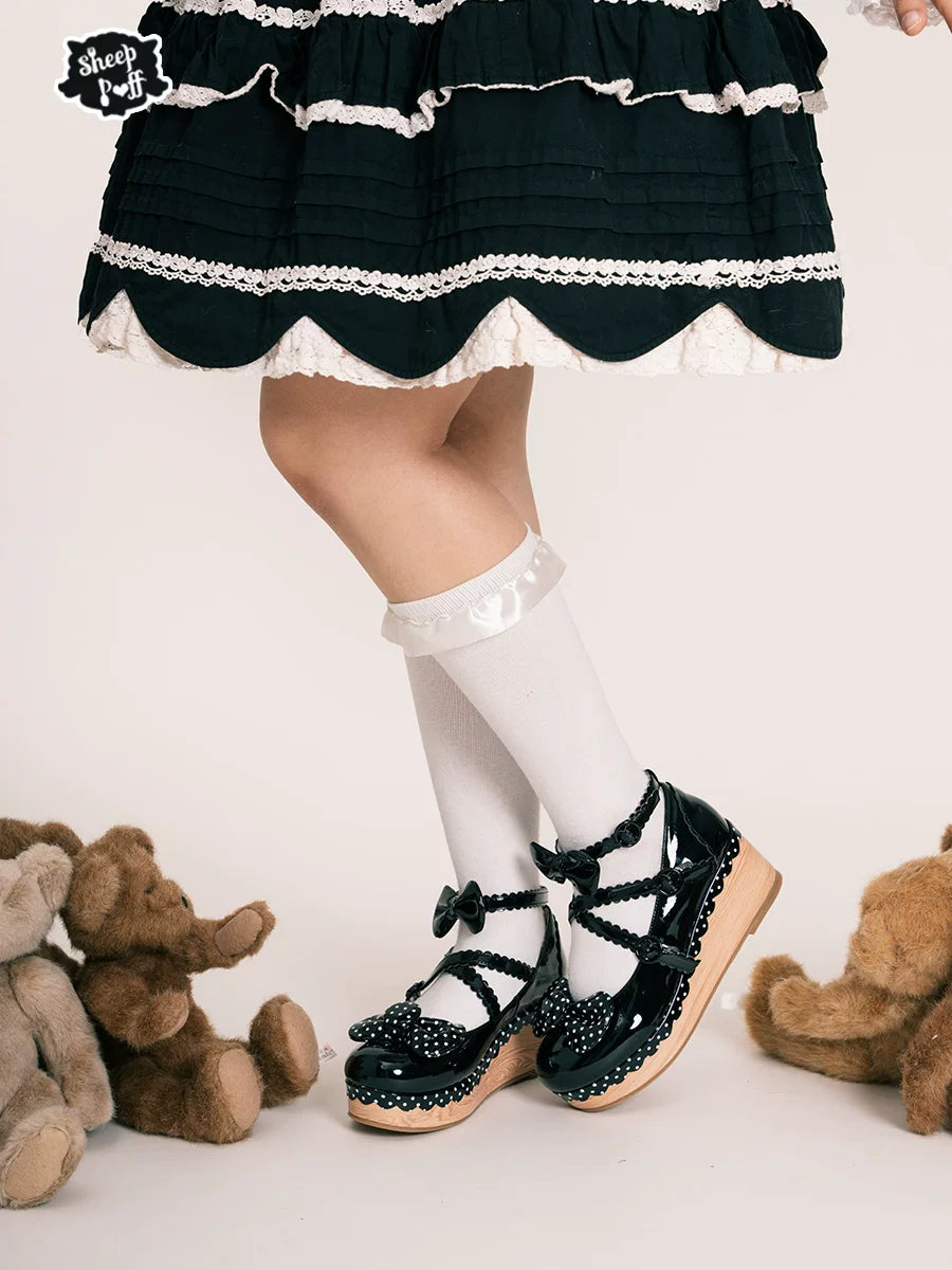 Sheep Puff vintage polka dot platform Lolita shoes with rounded toe and floral embellishments on a white background.