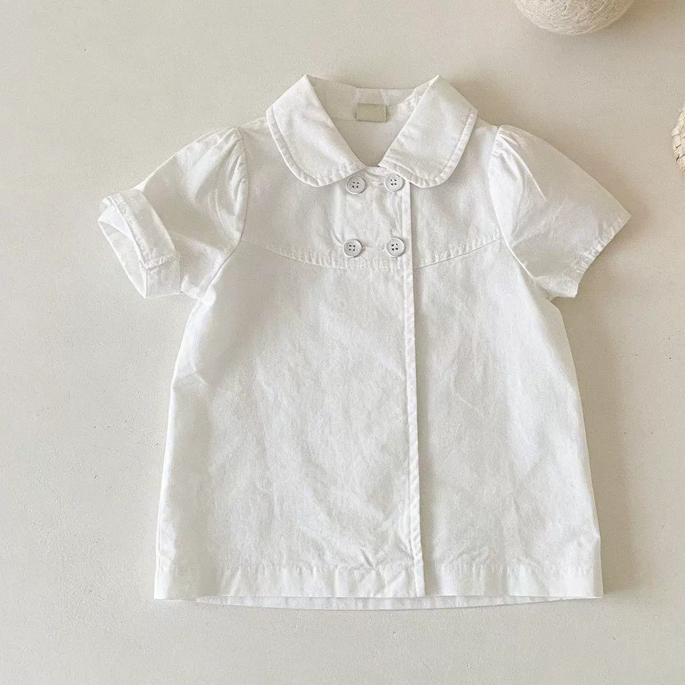 White short-sleeve blouse laid flat with a rounded collar, puff sleeves and four front buttons
