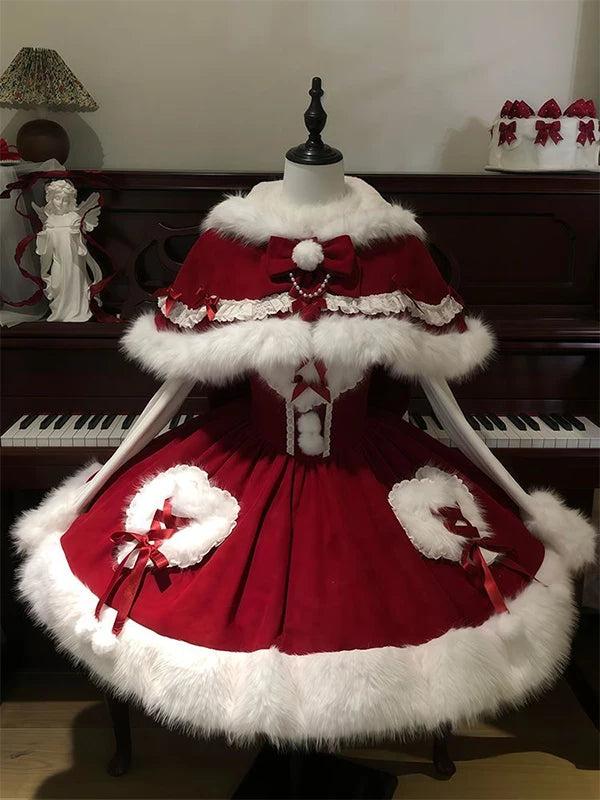 Red cape dress set with white plush trim and bows displayed on a mannequin.