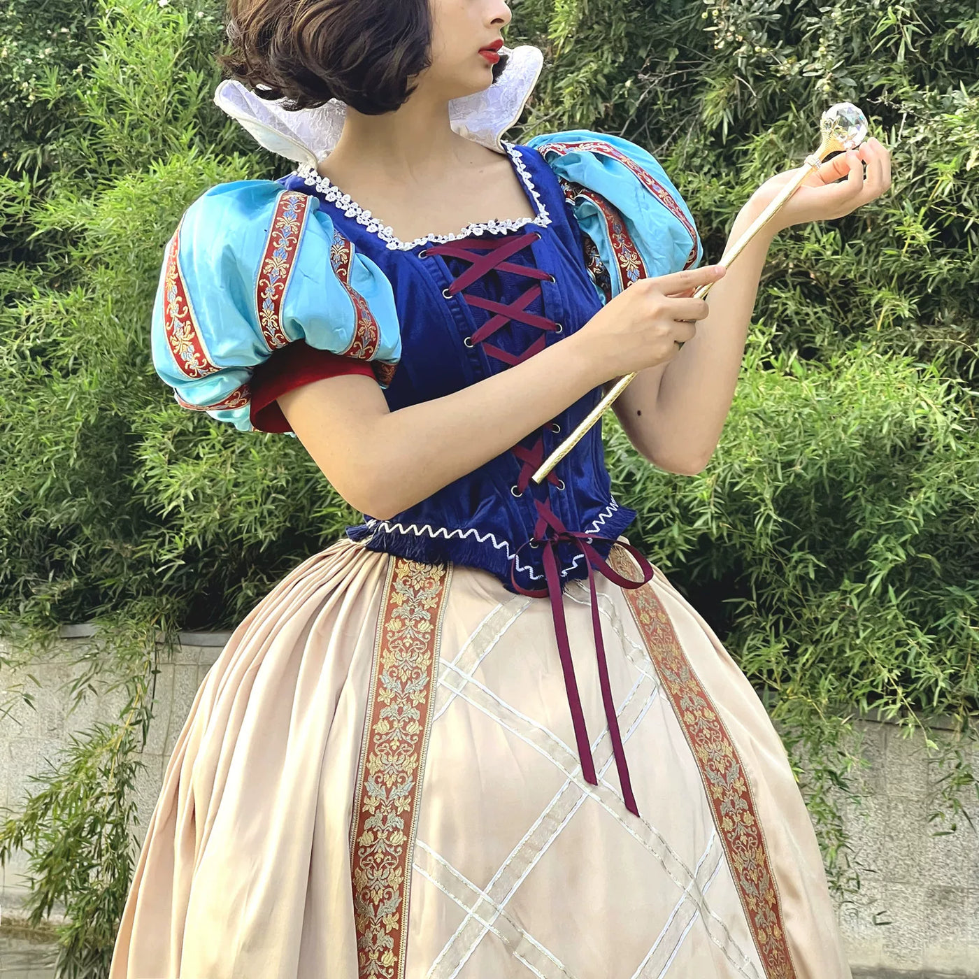 Royal blue dress set with light-blue puff sleeves and a full cream skirt.