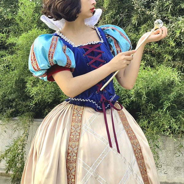 Royal blue dress set with light-blue puff sleeves and a full cream skirt.