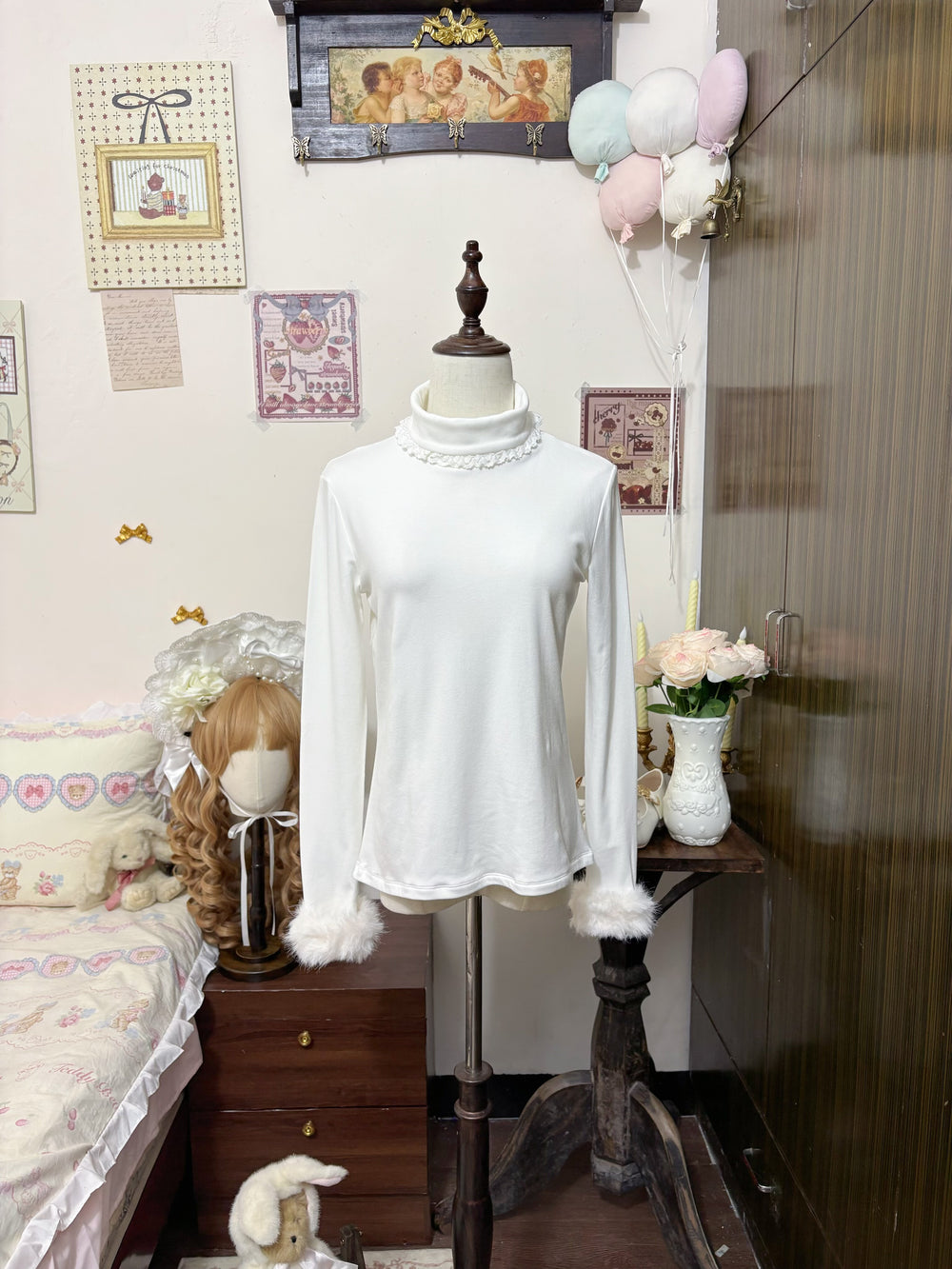 White high-neck Lolita base-layer top with lace collar and fuzzy cuffs displayed on a mannequin.