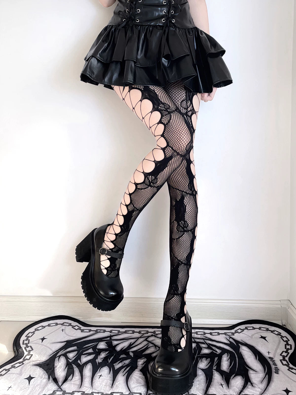 White floral lace pantyhose and black side-cutout fishnet tights shown on models.