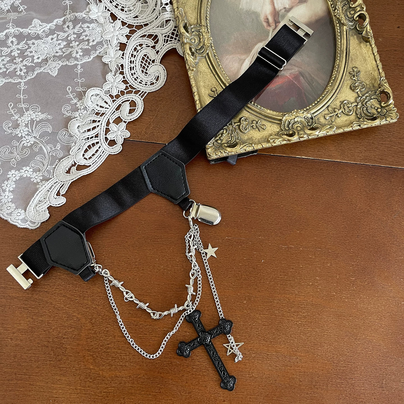 Cross-and-chain leg ring and gray socks shown in styling imagery