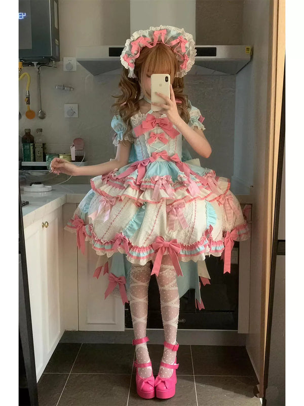 Creamy mint, pink and ivory OP dress with layered ruffles, ribbon bows, matching hat and train.