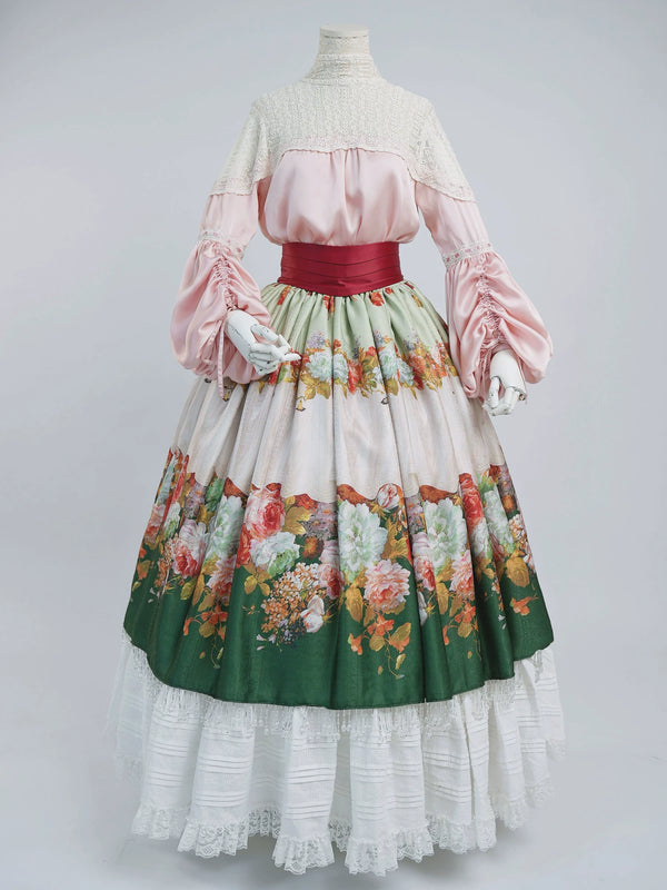 LACE GARDEN Rainy Season Garden pink lace blouse and green floral full skirt with a wine-red waist cincher on a mannequin.