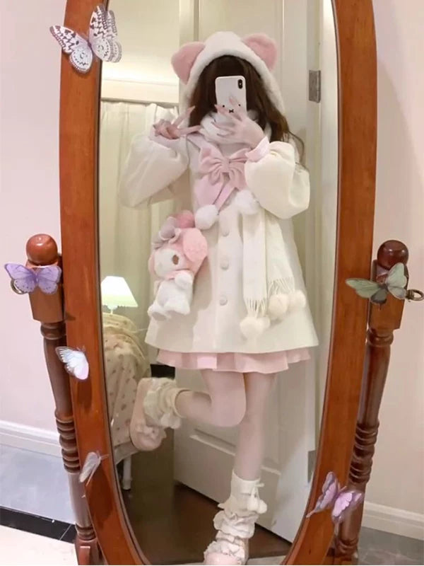 White and pink hooded outerwear with bow and half skirt shown in mirror photos