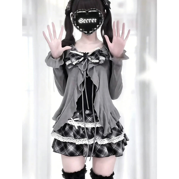 Gray cardigan, black inner top and black plaid skirt with ruffles and white lace on a model