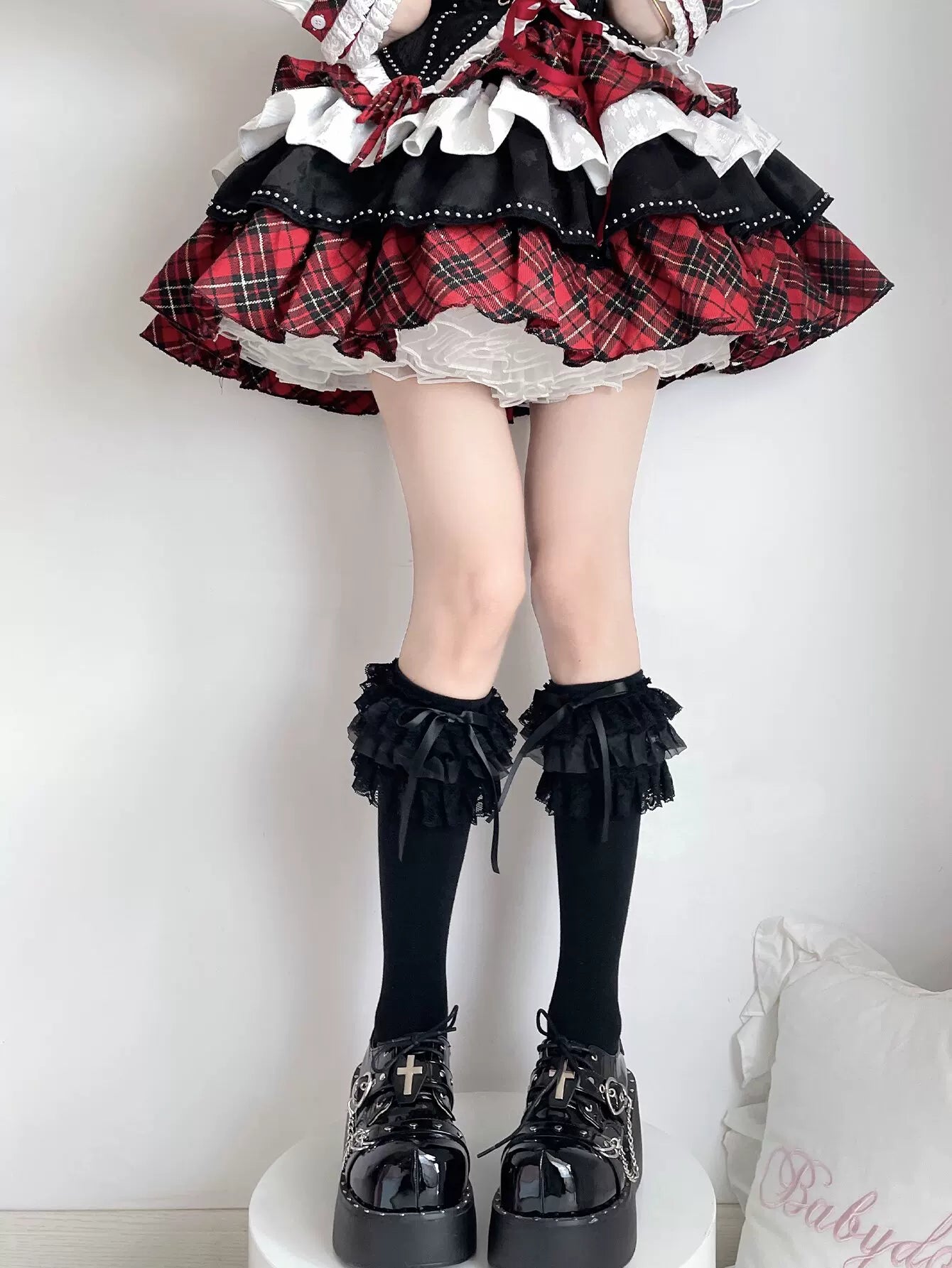 Fantasy Doll black lace calf socks with white bows styled on a model
