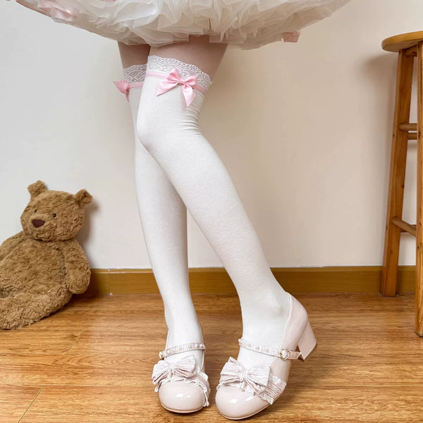 White socks with contrasting side bows styled with ruffled Lolita skirts and Mary Jane shoes.