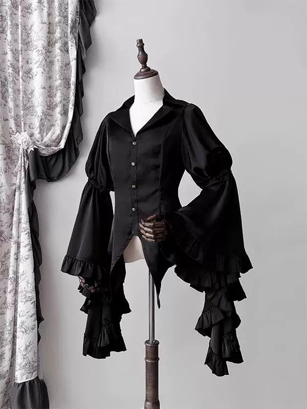 Creamy black gothic blouse with puffed sleeves and ruffled flared cuffs