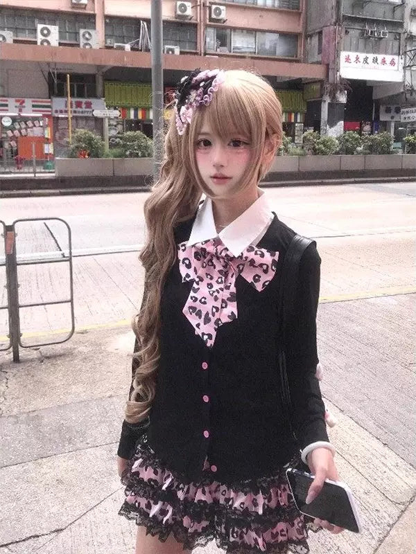 Sweet lolita two-piece coord set with black cardigan, white collared shirt, leopard-print bow, and pink tiered ruffled skirt