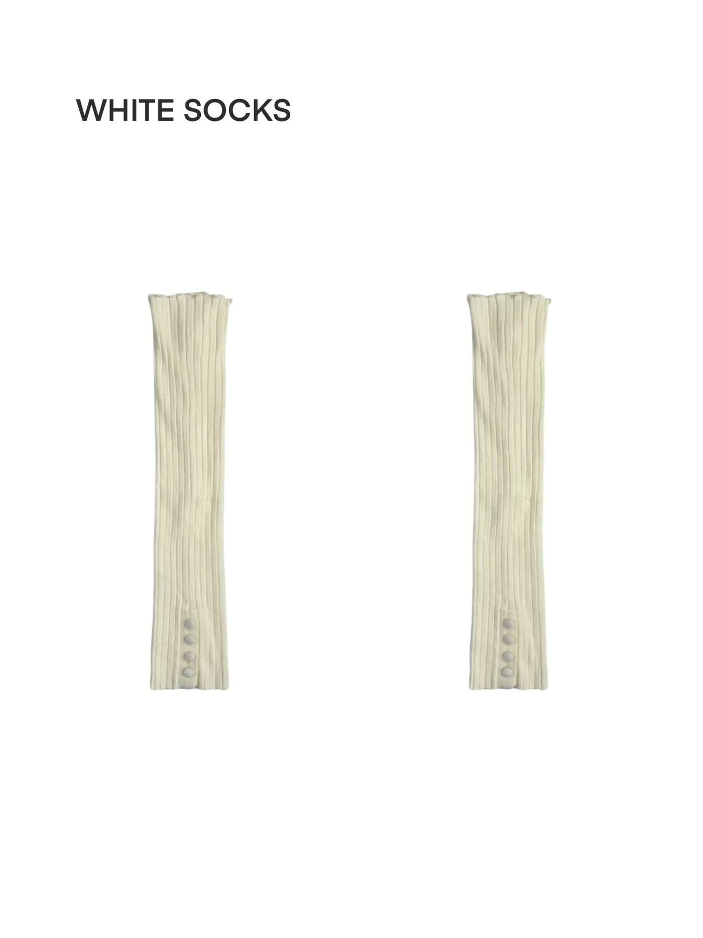 Ivory ribbed leg warmers with long tie details styled over dark tights and shoes.