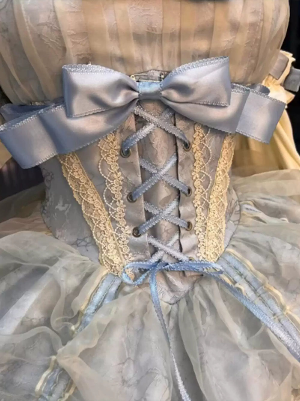 Apricot-blue and ivory layered JSK on a mannequin with bows and lace trim.