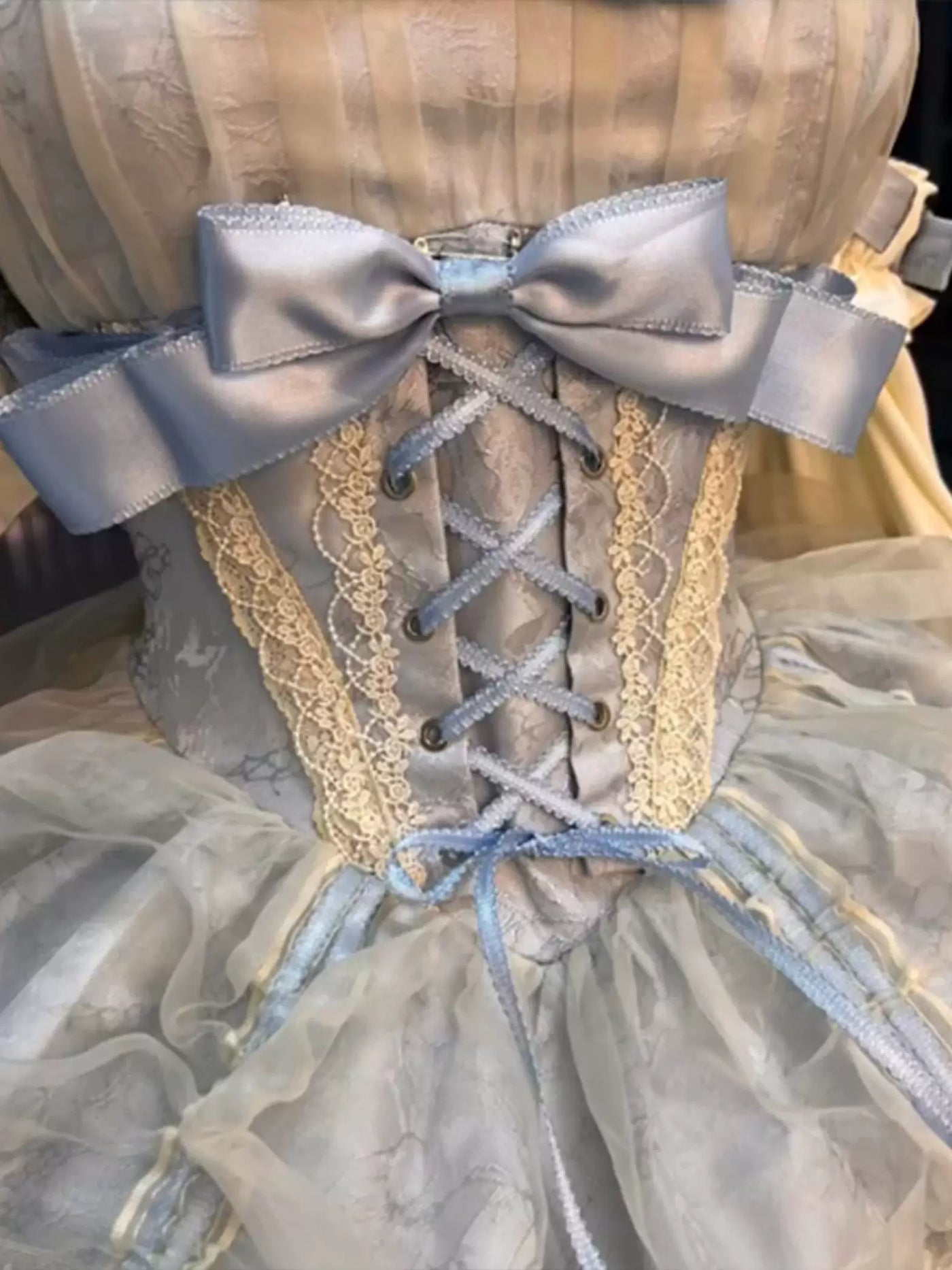 Apricot-blue and ivory layered JSK on a mannequin with bows and lace trim.