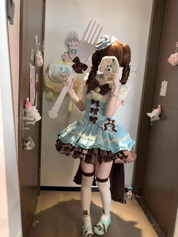 Blue-and-brown five-piece Lolita set styled on a model with layered ruffles, bows and a train