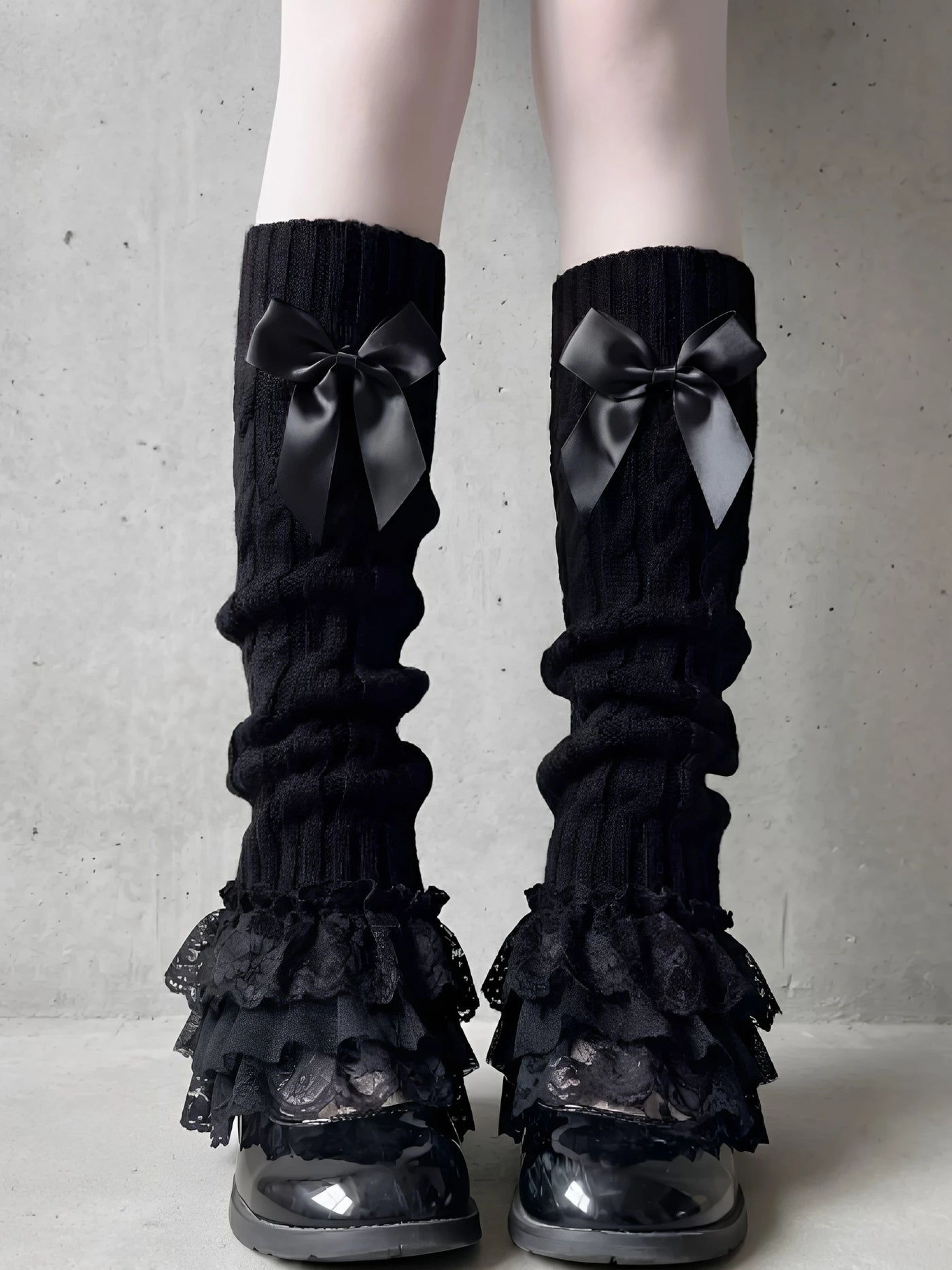 Fantasy Doll black knit leg warmers with bows and layered lace trim styled with platform shoes.