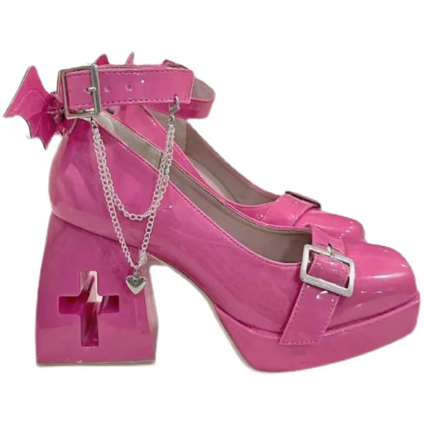 Glossy pink Mary Jane high heels with cross-shaped heel cutout, silver buckles and ankle strap