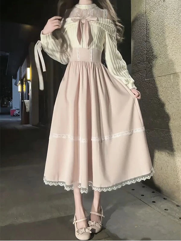 Creamy soft pink princess dress with bows and lace-trimmed skirt