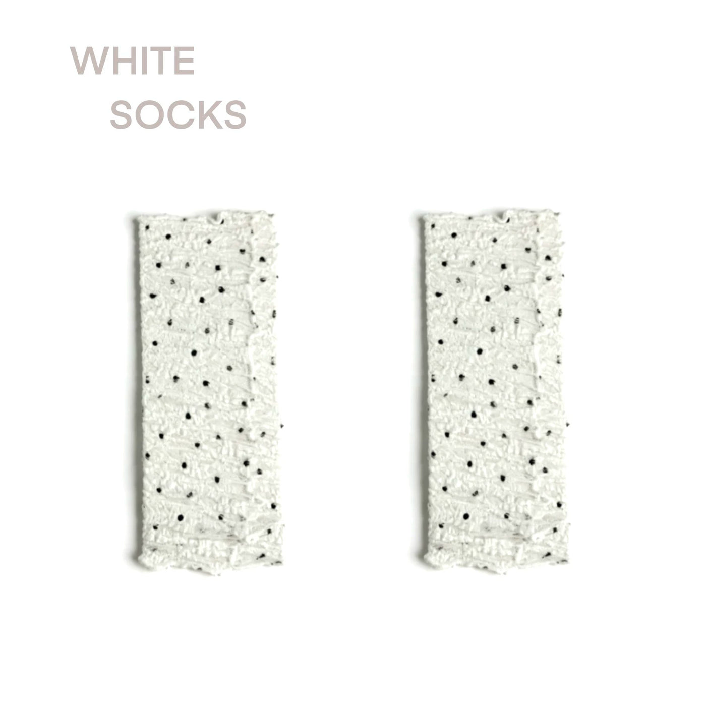 Sheer white mid-calf sock with black polka dots, ruched ankle, lace cuff, and satin ribbon tie